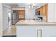 Functional kitchen with stainless steel appliances and plenty of counter space at 1680 S Patton Ct, Denver, CO 80219