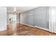 Spacious living room featuring hardwood floors, neutral walls, and an open floor plan, perfect for gatherings at 1680 S Patton Ct, Denver, CO 80219