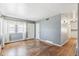 Cozy living room featuring hardwood floors, neutral walls, and natural light, creating a comfortable and inviting space at 1680 S Patton Ct, Denver, CO 80219
