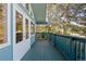 Private balcony with green railing and lush greenery offers scenic views and outdoor enjoyment at 310 S Alkire St, Lakewood, CO 80228