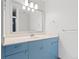 Charming bathroom with vanity, bright light fixture, and a sink basin at 310 S Alkire St, Lakewood, CO 80228