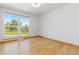 Bright bedroom with large windows offering scenic views and hardwood floors at 310 S Alkire St, Lakewood, CO 80228
