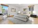 Serene bedroom with contemporary decor, hardwood floors, and ample natural light at 310 S Alkire St, Lakewood, CO 80228
