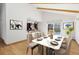 Bright dining room with sleek table, modern chairs, and views of the pool at 310 S Alkire St, Lakewood, CO 80228
