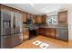 Modern kitchen with stainless steel refrigerator and updated appliances at 310 S Alkire St, Lakewood, CO 80228