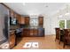 Bright kitchen featuring stainless steel appliances and a sunny dining area at 310 S Alkire St, Lakewood, CO 80228