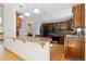 Spacious kitchen with granite countertops and stylish hanging lights at 310 S Alkire St, Lakewood, CO 80228