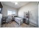 Bedroom with desk, chair, and bookshelf at 12069 Monaco Ct, Brighton, CO 80602