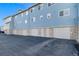 Well-maintained apartment building exterior, showcasing a modern design and convenient parking spaces at 12069 Monaco Ct, Brighton, CO 80602