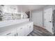 Bright kitchen with white cabinets, countertops, stainless steel appliances, and ample counter space at 12069 Monaco Ct, Brighton, CO 80602