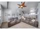 Open living room featuring comfortable seating and a staircase at 12069 Monaco Ct, Brighton, CO 80602