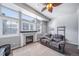 Inviting living room with fireplace, large windows, and comfortable seating at 12069 Monaco Ct, Brighton, CO 80602