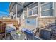 Relaxing patio area featuring cushioned seating, great for unwinding and outdoor enjoyment at 12069 Monaco Ct, Brighton, CO 80602