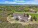 Expansive aerial view of a luxury home with a large lot, featuring a boat and trampoline at 4222 Serenade Rd, Castle Rock, CO 80104