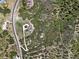 Remote aerial view of a luxury home at the end of a long driveway surrounded by natural forest at 4222 Serenade Rd, Castle Rock, CO 80104