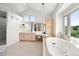 Bright bathroom showcasing a double vanity, soaking tub, and large window with a view at 4222 Serenade Rd, Castle Rock, CO 80104