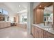 Bright bathroom with dual sinks, lots of counter space, and tub under window at 4222 Serenade Rd, Castle Rock, CO 80104