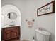 Half bathroom with decorative signs and wood accents at 4222 Serenade Rd, Castle Rock, CO 80104