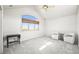 Bright, spacious bedroom with a large window, vaulted ceiling, and comfortable seating area at 4222 Serenade Rd, Castle Rock, CO 80104
