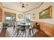 Elegant dining room with wood trim, deck access, and unique furnishings at 4222 Serenade Rd, Castle Rock, CO 80104