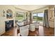 Bright dining room with fireplace, large windows, and nature views at 4222 Serenade Rd, Castle Rock, CO 80104