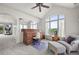 Charming office space featuring a roll-top desk, comfortable seating, and a large window with a view at 4222 Serenade Rd, Castle Rock, CO 80104