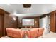Cozy movie theater with comfortable reclining seats, screen and surround sound at 4222 Serenade Rd, Castle Rock, CO 80104