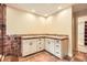 Bathroom featuring double sinks, tile and cabinets at 4401 Sombrero Cir, Littleton, CO 80123