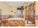 Bathroom with soaking tub and a glass-enclosed shower at 4401 Sombrero Cir, Littleton, CO 80123