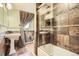 Bathroom with shower and double sinks at 4401 Sombrero Cir, Littleton, CO 80123
