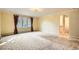 Bright bedroom with large windows and patterned carpet at 4401 Sombrero Cir, Littleton, CO 80123