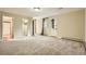 Spacious bedroom with neutral carpet, ample natural light and multiple entry ways at 4401 Sombrero Cir, Littleton, CO 80123
