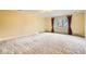 Bright bedroom with large windows and patterned carpet at 4401 Sombrero Cir, Littleton, CO 80123