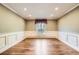 Spacious dining room featuring hardwood floors, decorative molding, and natural light at 4401 Sombrero Cir, Littleton, CO 80123