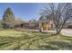 Ranch-style home featuring brick accents and professional landscaping in the front yard at 4401 Sombrero Cir, Littleton, CO 80123