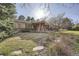 Home featuring a covered front porch, stone walkway, and lush landscaping at 4401 Sombrero Cir, Littleton, CO 80123