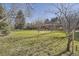 Expansive front yard with mature trees surrounding a single-story home at 4401 Sombrero Cir, Littleton, CO 80123