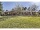 Sprawling ranch-style home with a manicured lawn and mature landscaping at 4401 Sombrero Cir, Littleton, CO 80123