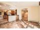 Bright kitchen with stainless appliances, custom cabinets and tile flooring at 4401 Sombrero Cir, Littleton, CO 80123