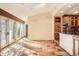 Bright kitchen and breakfast nook featuring custom cabinets, skylight and tile flooring at 4401 Sombrero Cir, Littleton, CO 80123