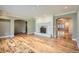 Open-concept living room with hardwood floors, fireplace, and arched doorways at 4401 Sombrero Cir, Littleton, CO 80123
