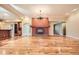 Open living room featuring hardwood floors, fireplace and a chandelier at 4401 Sombrero Cir, Littleton, CO 80123