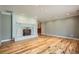 Hardwood floors, fireplace, and open archways featured in this bright living room at 4401 Sombrero Cir, Littleton, CO 80123