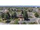 Aerial view of the community clubhouse, parking, and pond at 23 Carla Way, Broomfield, CO 80020