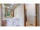 Bathroom features a walk-in shower, large mirror, and neutral vanity at 23 Carla Way, Broomfield, CO 80020