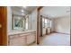 Bathroom features a large vanity with a sink and a connecting bedroom at 23 Carla Way, Broomfield, CO 80020