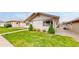 Charming home front lawn with small shrubs and decorative trees enhancing its curb appeal and landscape at 23 Carla Way, Broomfield, CO 80020