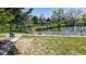 Scenic community pond view featuring lush green lawns and well-maintained walking paths at 23 Carla Way, Broomfield, CO 80020