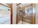 Shower features gold trim and tile and has an entryway into the bedroom at 23 Carla Way, Broomfield, CO 80020