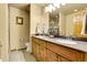 Bathroom featuring double sinks, a large mirror and a separate shower stall at 4700 Homestead St, Bow Mar, CO 80123
